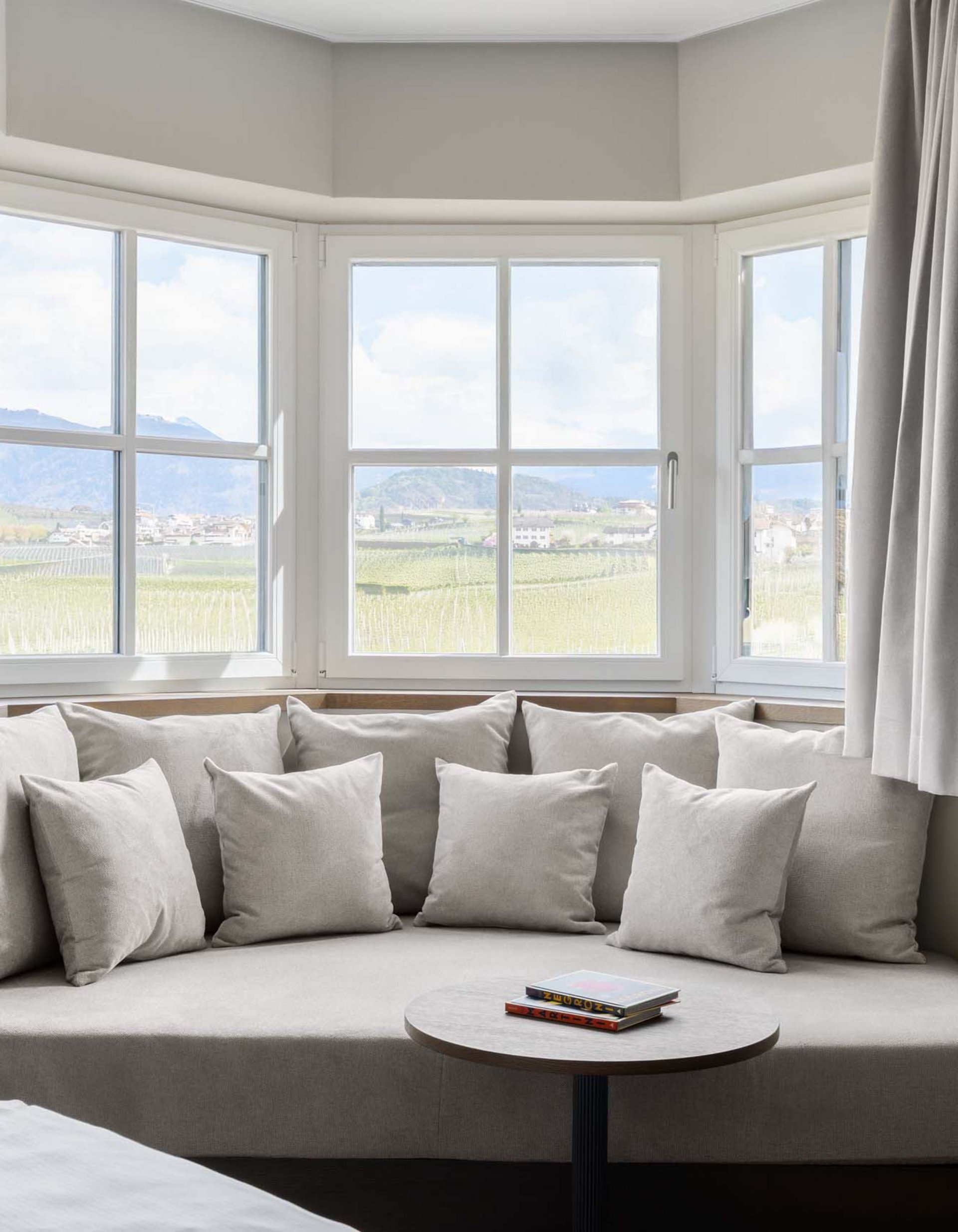 Lingers’ best snapshots Cozy seating area with window overlooking vineyards and mountains