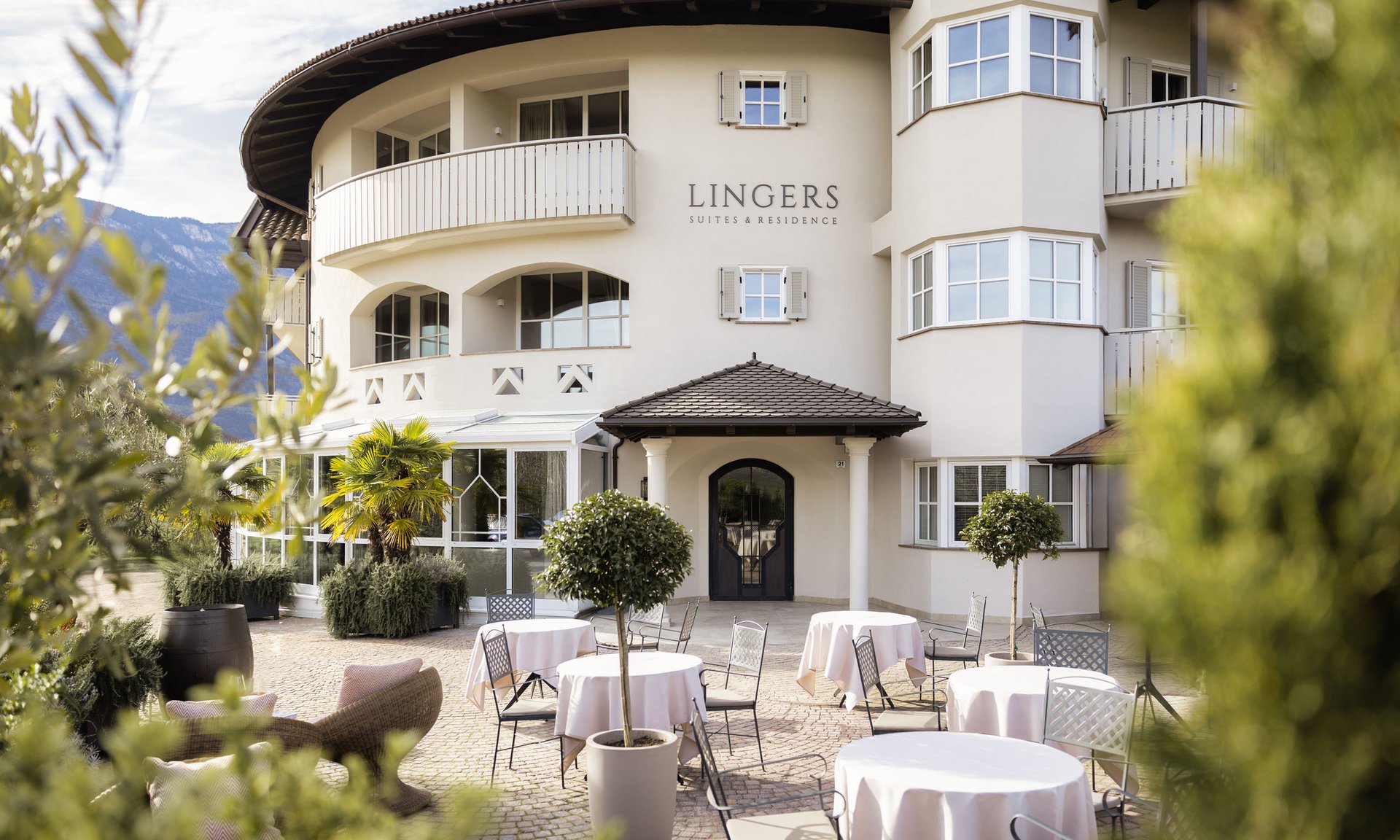 Lingers’ best snapshots Outdoor seating area with tables and chairs at Lingers Suites & Residence